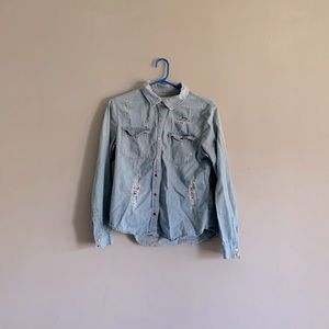 Distressed button down denim shirt